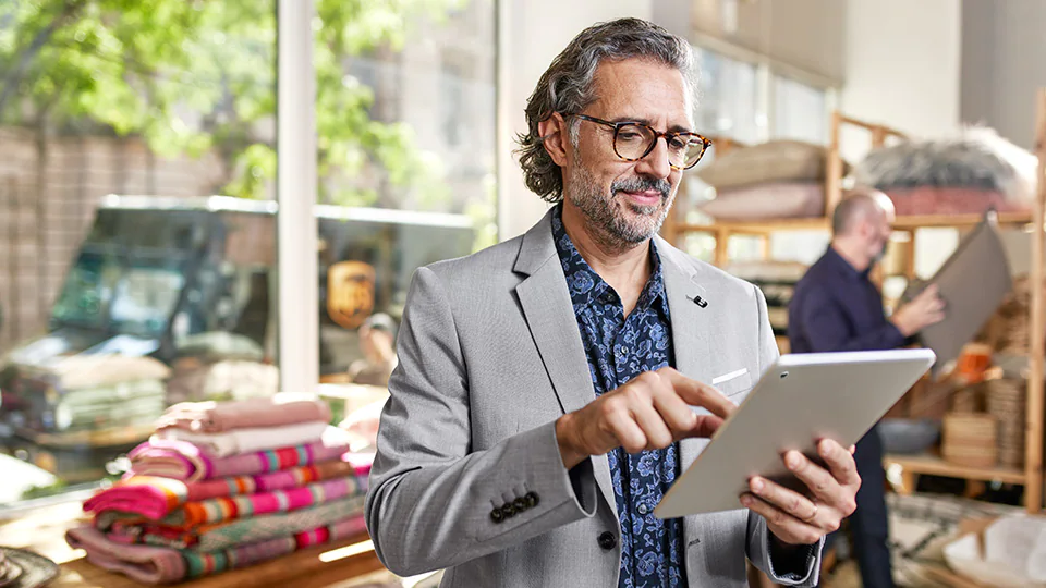 Man looking at tablet